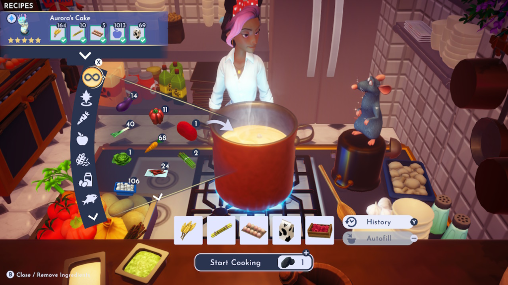 A screenshot of Disney's Dreamlight Valley. The character is cooking Aurora's Cake in Remy's kitchen.