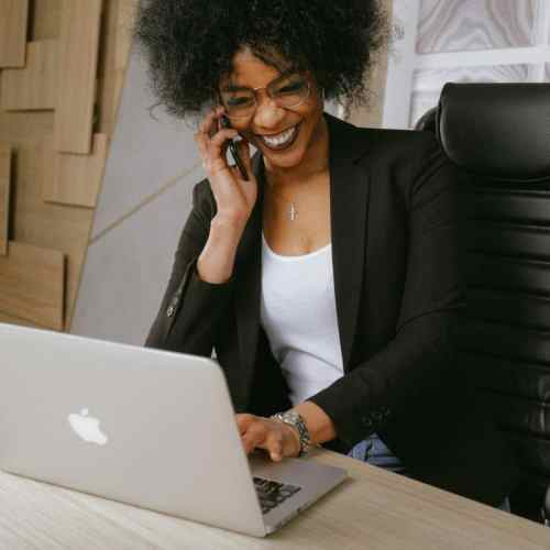 woman in black blazer sitting on black office chair